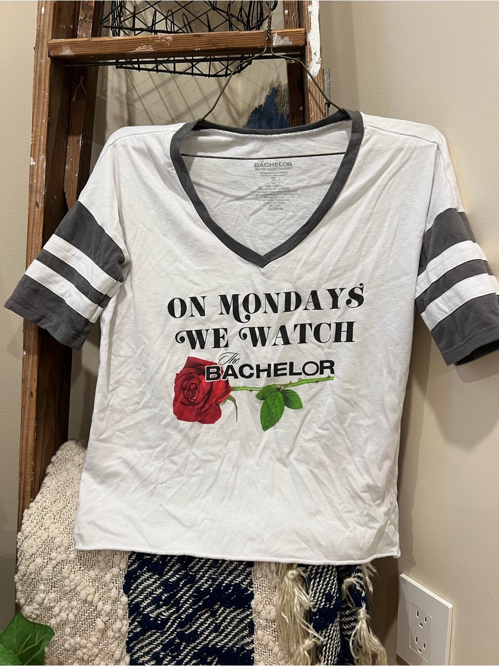 The Bachelor Graphic V‑Neck Tee 🌹